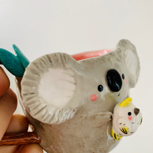 Koala with cockatoo friend mug