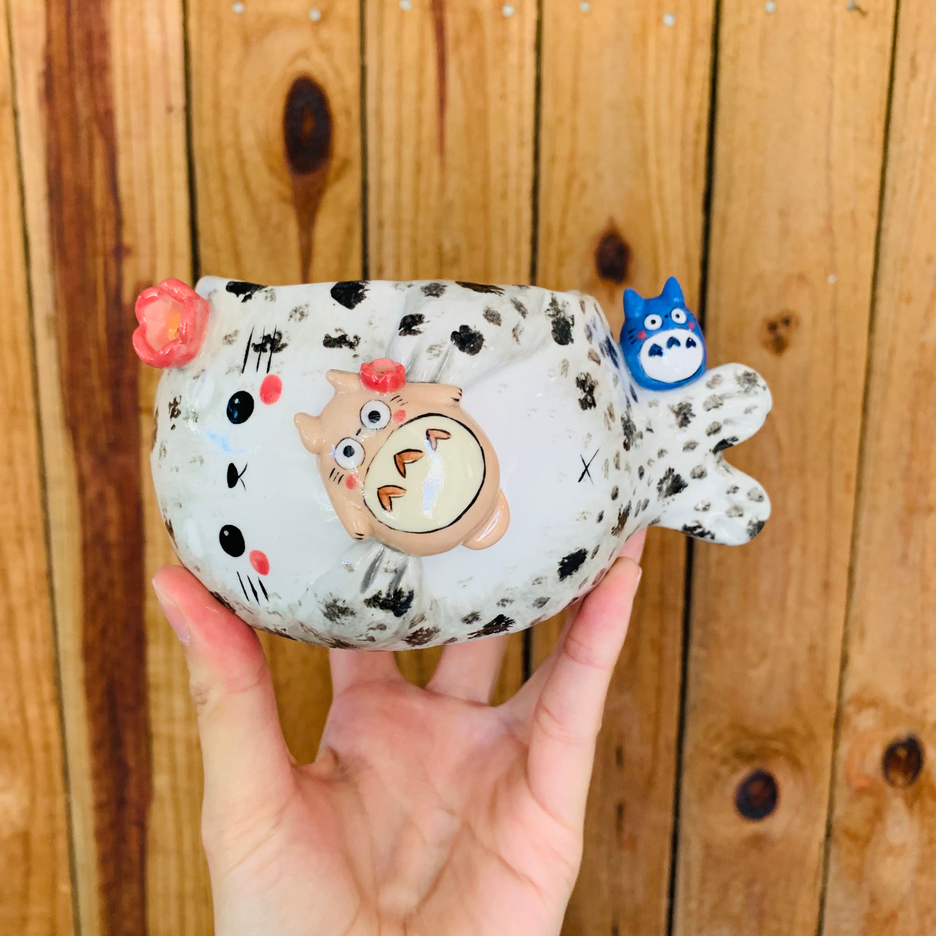 Chubby spotted seal with Totoro friends pot