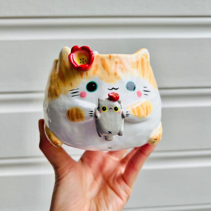 Ginger cat pot with grey cat friend