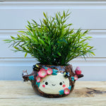 Happy flowery tree with bees, bunny and pink galah planter