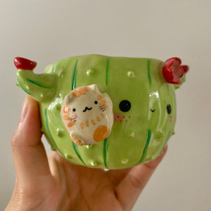 Flowery cactus pot with cat friend