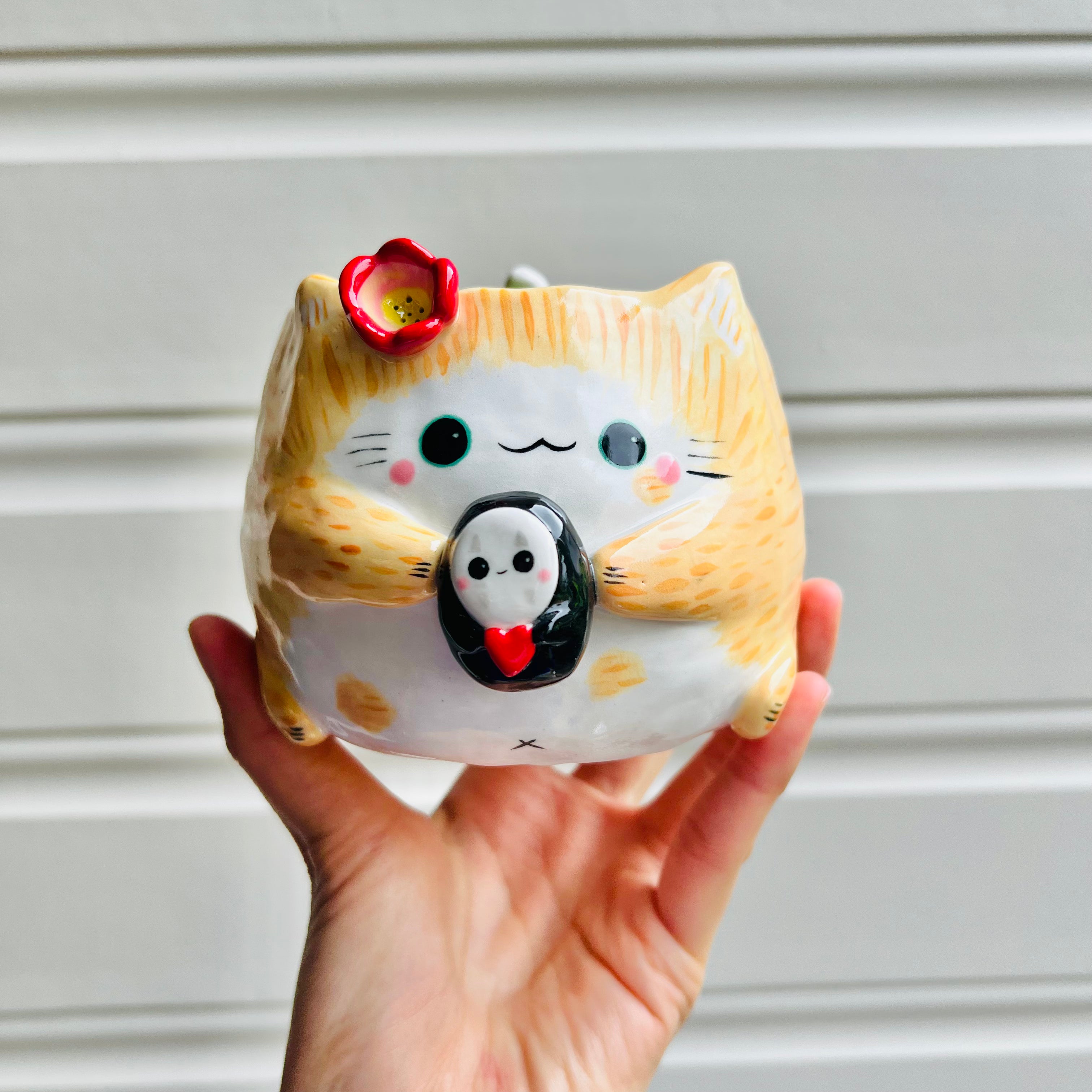 Ginger cat pot with No face friend