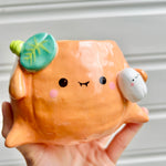 Halloween pumpkin pot with ghost friend