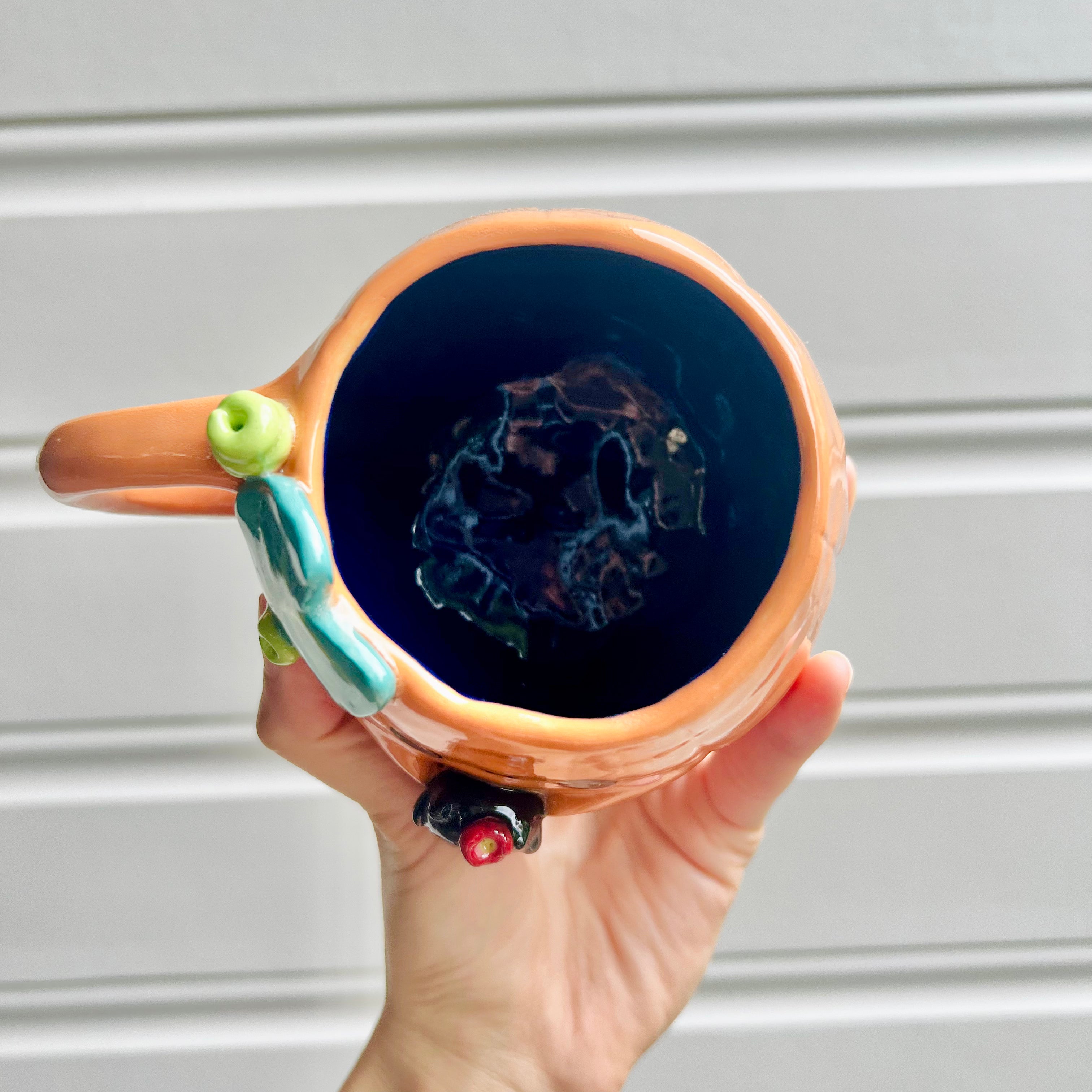 Halloween pumpkin mug with black cat friend