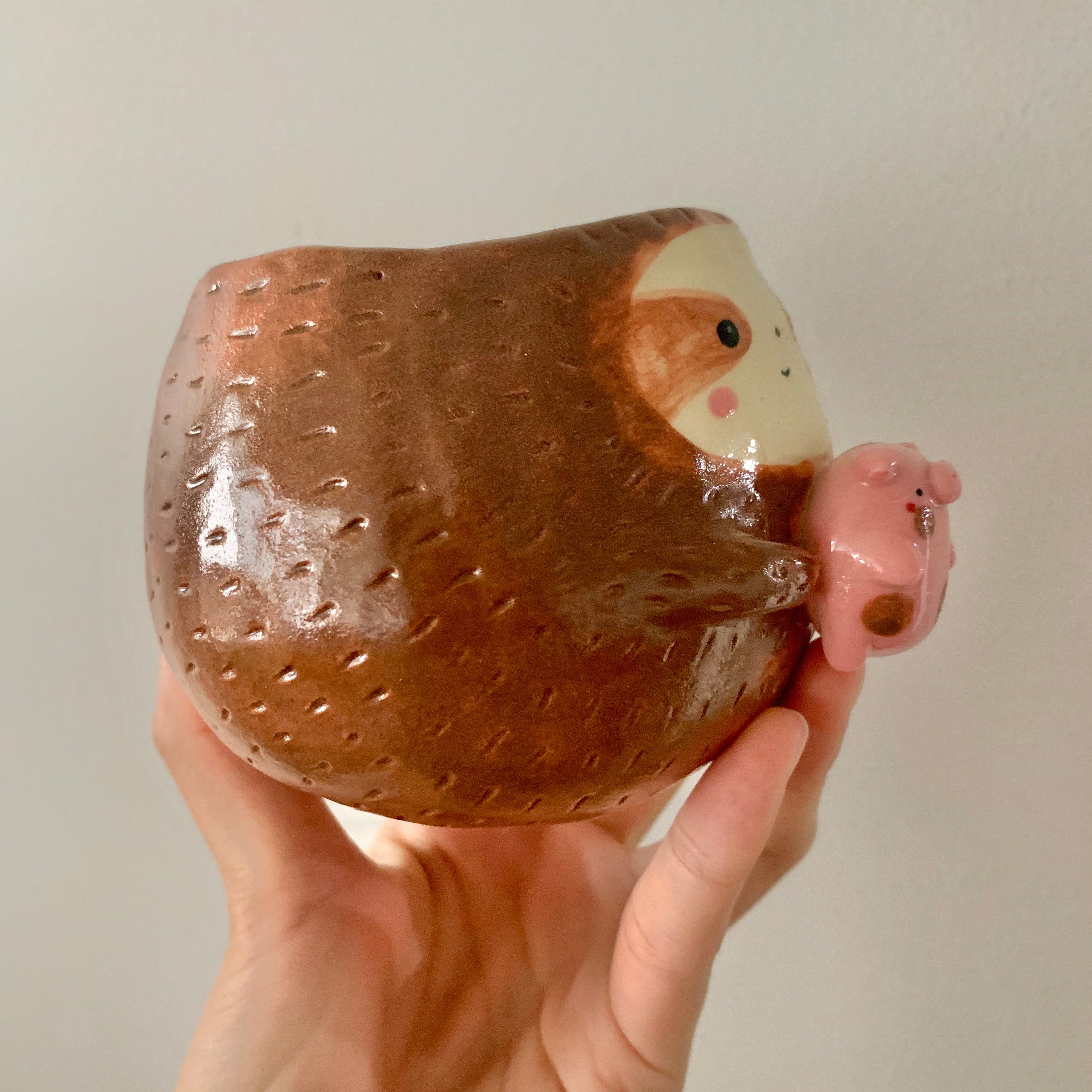 Friendly sloth pot with pig friend