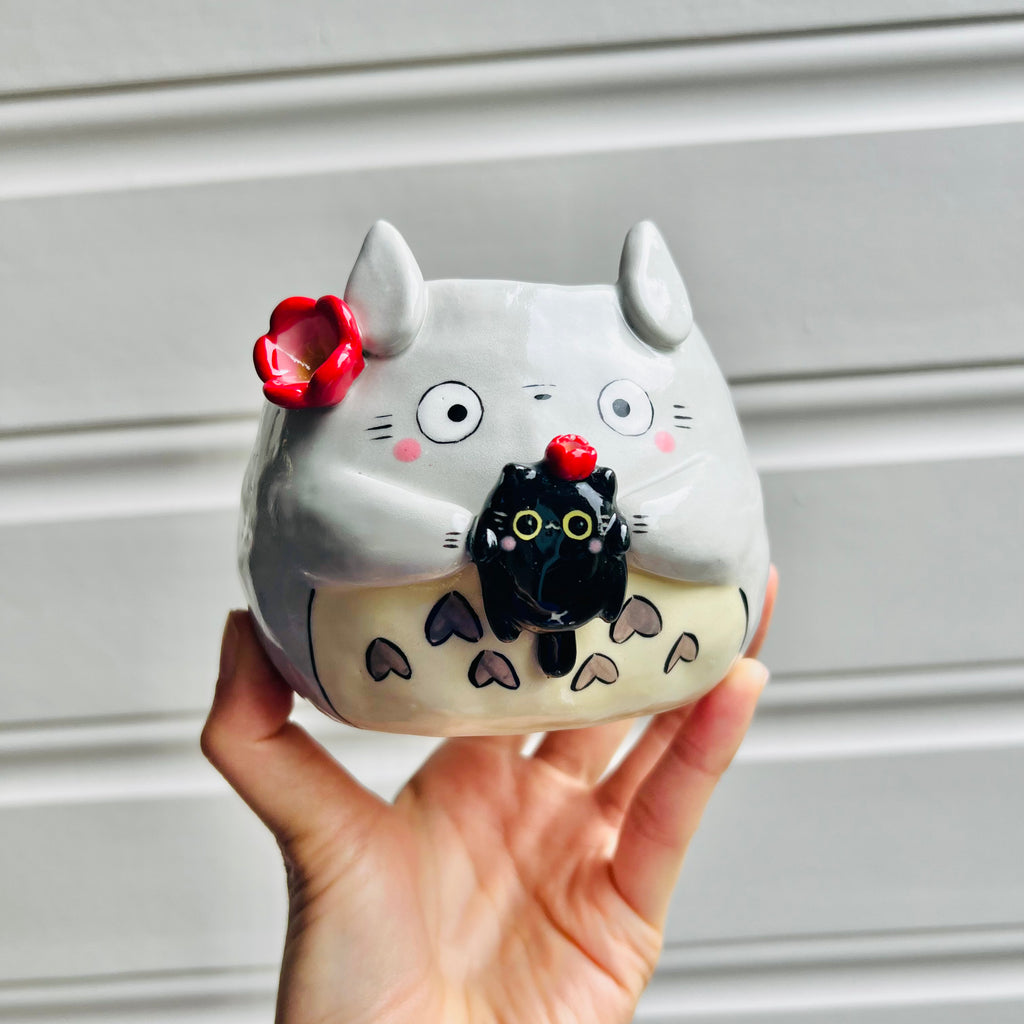 Totoro pot with black cat friend