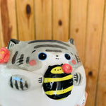 Stripey grey cat pot with bee friend