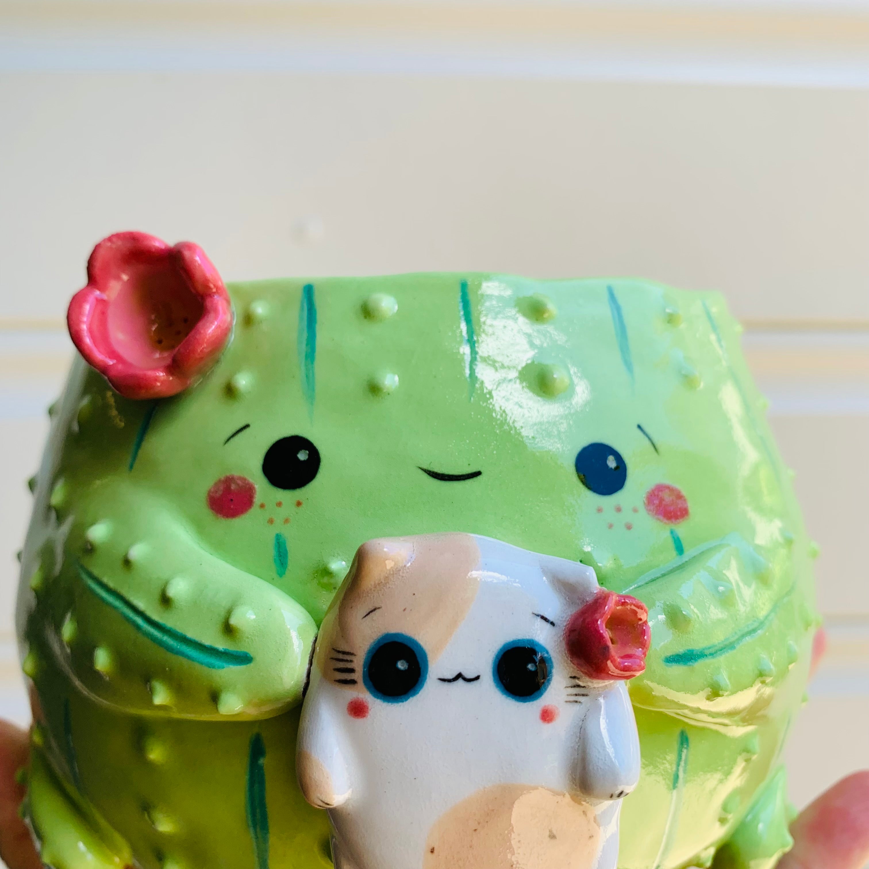 Flowery cactus pot with cat friend