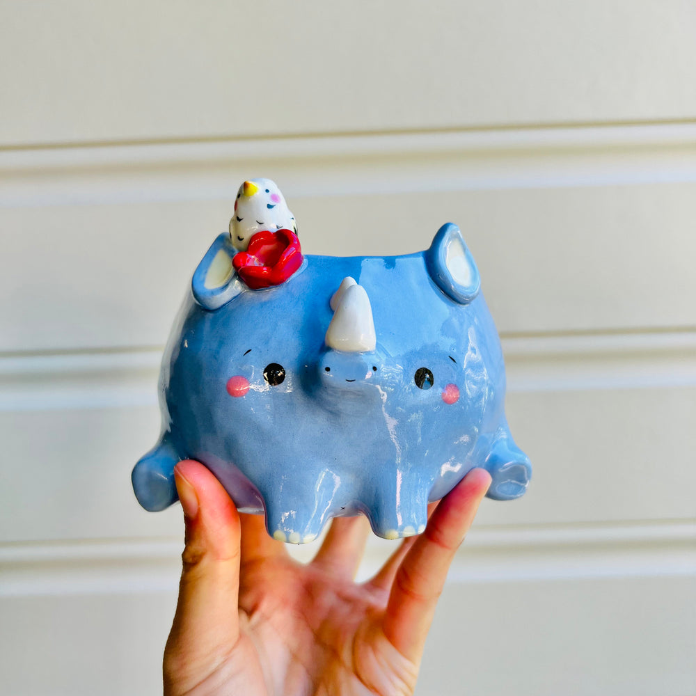 Rhino pot with egret friend, photo 1 of 5