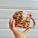 Hat wearing tiger with mandarin friend mug with baby tiger