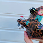 Happy flowery tree with bees, cat and pink galah planter