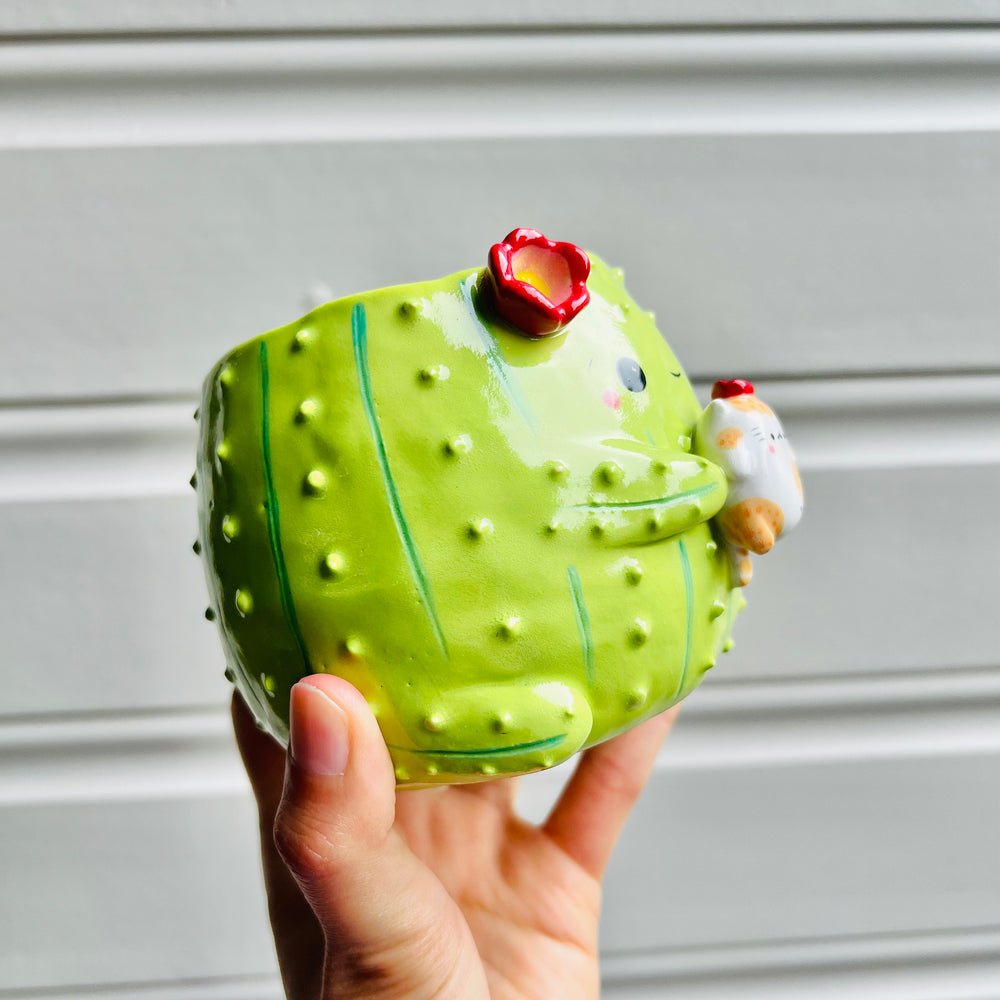 Flowery cactus pot with ginger cat friend, photo 2 of 5