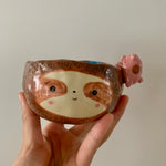 Friendly sloth snack bowl with pig friend