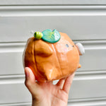 Halloween pumpkin pot with ghost friend